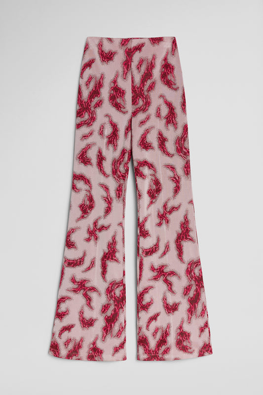 Flared pants with red abstract pattern on a white background