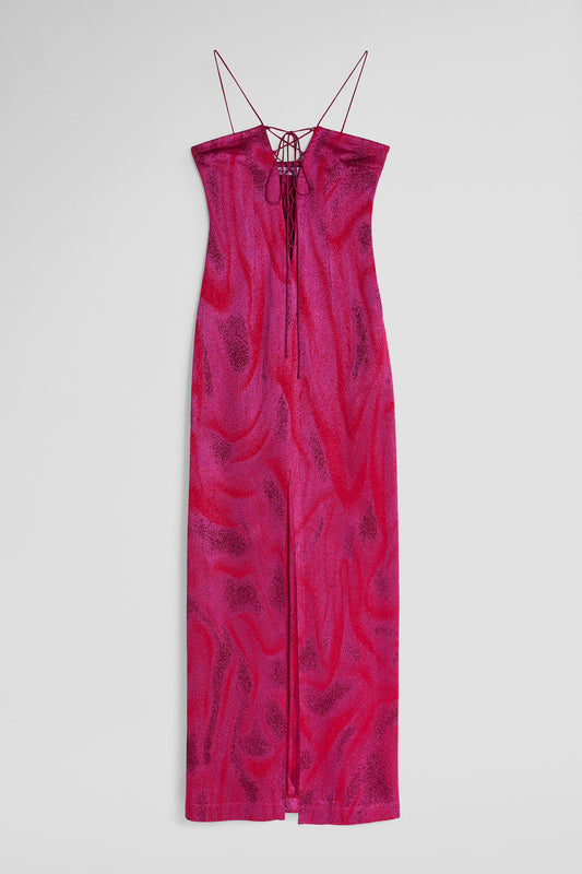 A fuchsia patterned MACCAPANI Iris dress with lace up detail on a grey background
