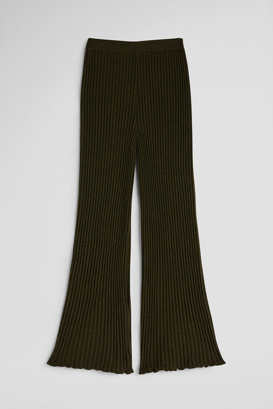 Dark ribbed knit pants on a light gray background