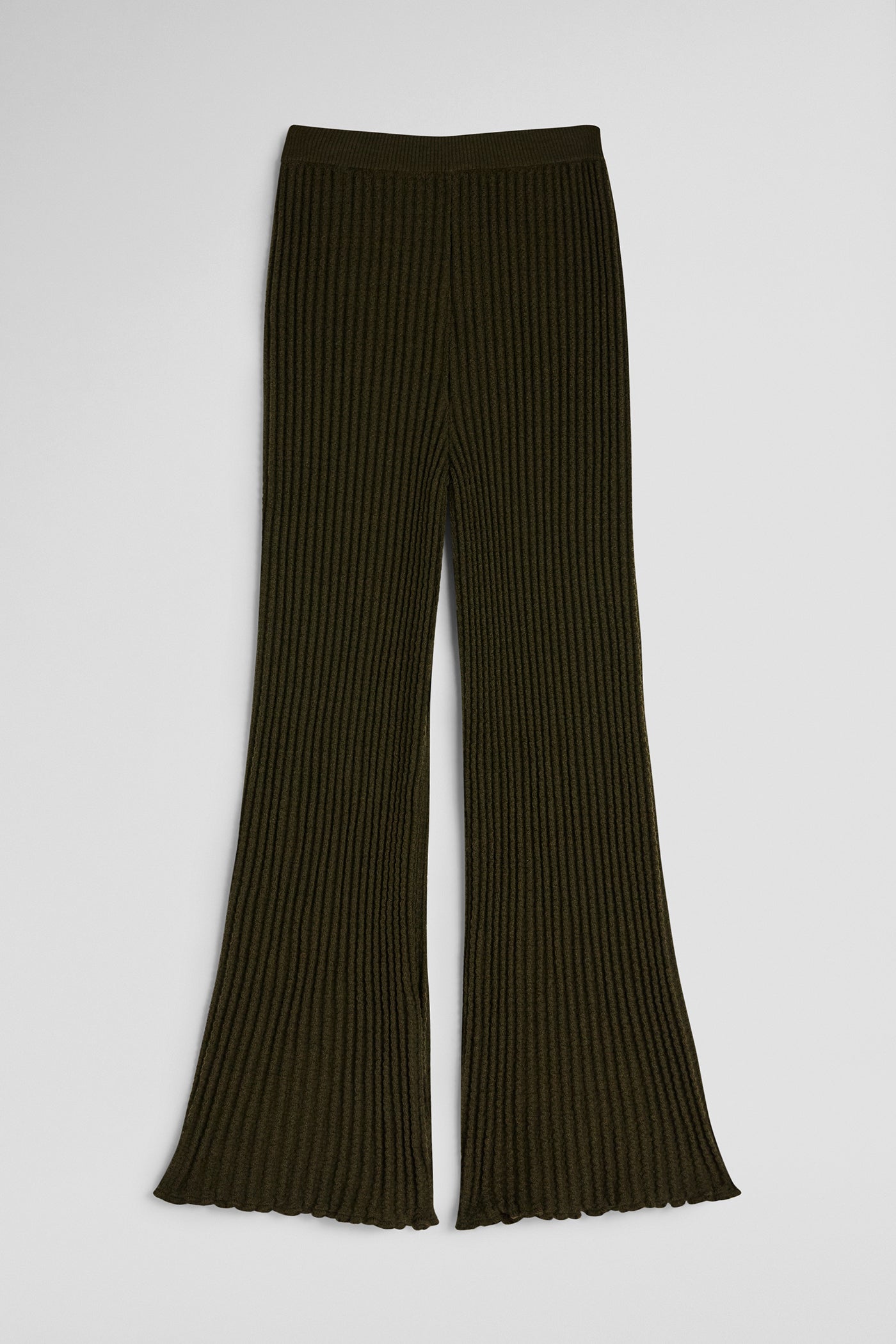 Dark ribbed knit pants on a light gray background